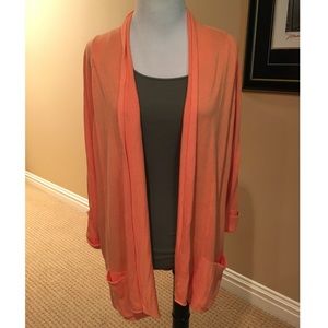 Bright orange cardigan w/pockets on front